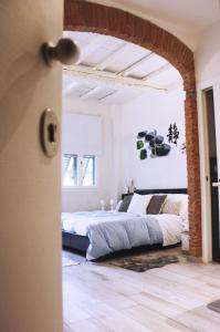 En eller flere senger på et rom på Appartamento in via San Gallo