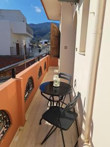 a table and chairs on a balcony with a view at Stella Apartments Malia in Malia
