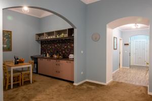 an archway in a kitchen with a table and a counter at City Life Timisoara in Timişoara +18 photos