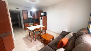 a living room with a couch and a table at Cal Ginés in Llimiana