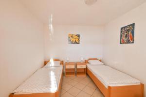 Posteľ alebo postele v izbe v ubytovaní Apartments Boženka