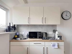 Kuchyň nebo kuchyňský kout v ubytování Schöne Apartments I private Parkplätze I home2share