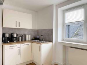 Kuchyň nebo kuchyňský kout v ubytování Schöne Apartments I private Parkplätze I home2share