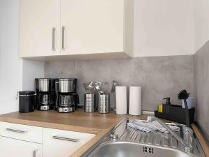 Kuchyň nebo kuchyňský kout v ubytování Schöne Apartments I private Parkplätze I home2share