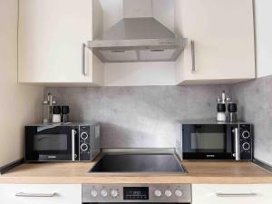 Kuchyň nebo kuchyňský kout v ubytování Schöne Apartments I private Parkplätze I home2share