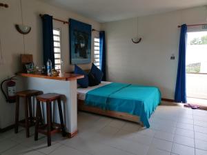Postel nebo postele na pokoji v ubytování Terre et Mer - Studios - Ile Maurice