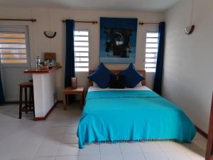 Postel nebo postele na pokoji v ubytování Terre et Mer - Studios - Ile Maurice