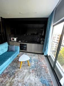 a living room with a couch and a table at PARANAIS APARTMENT 2 in Nairobi