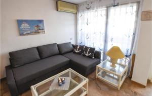 a living room with a couch and a table at 2 Bedroom Cozy Apartment In Aguadulce in Aguadulce
