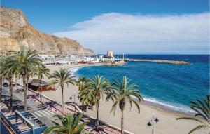 a view of a beach with palm trees and the ocean at 2 Bedroom Cozy Apartment In Aguadulce in Aguadulce