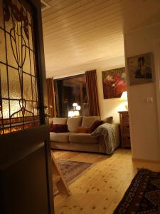 a living room with a couch and a window at Metsaräägu Wellness 