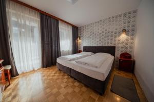 Postel nebo postele na pokoji v ubytování Hotel Maj Inn