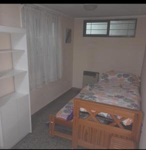 Giường trong phòng chung tại La Perla 3 amb