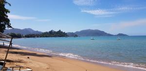 a view of a beach with boats in the water at Yulides home gardens in Cindakir