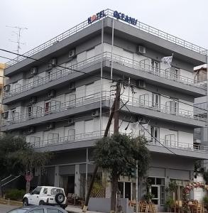 a building with people on the balconies of it at Oceanis in Thessaloniki