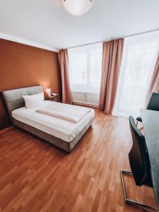 Postel nebo postele na pokoji v ubytování Zentral Hotel