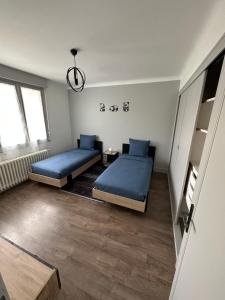 Łóżko lub łóżka w pokoju w obiekcie Gîte d'Esila