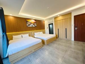 Postel nebo postele na pokoji v ubytování Ngọc Anh Hotel