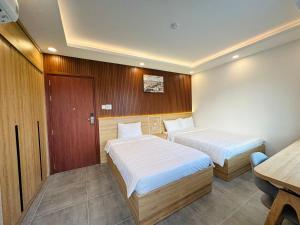 Postel nebo postele na pokoji v ubytování Ngọc Anh Hotel