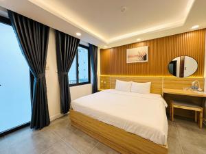 Postel nebo postele na pokoji v ubytování Ngọc Anh Hotel