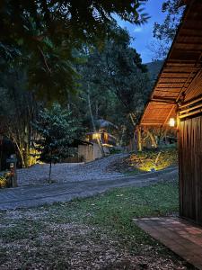 a path leading to a house at night at Greenspace Living in Ban Tha Phae