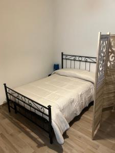 a bedroom with a bed with a white bedspread at La Torre in Santo Padre