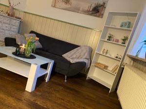 a living room with a couch and a table at Mia in Buchholz