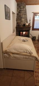 A bed or beds in a room at Magnolia Traditional Stone House in Vamvakou