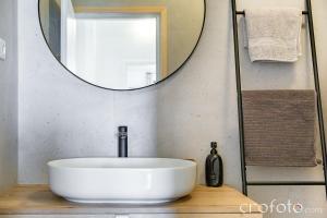 a bathroom with a round sink and a mirror at Villa Marcela in Preko +25 photos