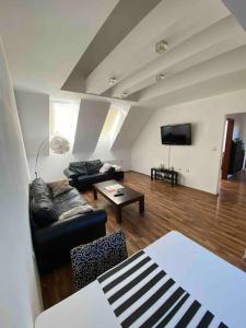 a living room with a couch and a table at Apartment in heart of city Trnava in Trnava