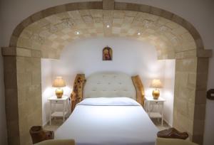 A bed or beds in a room at Tenute Al Bano