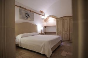 A bed or beds in a room at Tenute Al Bano