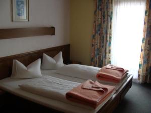Posteľ alebo postele v izbe v ubytovaní Hotel Garni Schieferle
