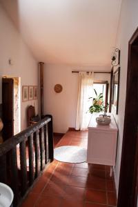a staircase leading to a room with a window at Casa Senhor da Ponte in Mondim de Basto