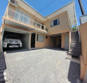 a car parked in the garage of a house at Pousada Ritter in Bento Gonçalves