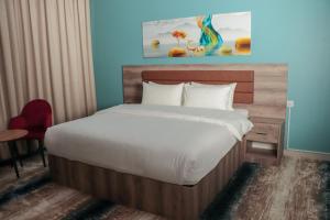 Postel nebo postele na pokoji v ubytování Ewann Hotel Apartments