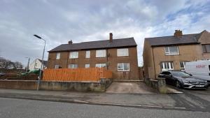 a house with a car parked in front of it at 36 Westview Terrace in Stornoway