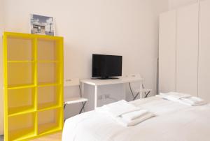 A bed or beds in a room at BnButler - Casa Lario - Isola District