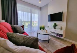 Televízia a/alebo spoločenská miestnosť v ubytovaní Westin House Resort Kołobrzeg - 109 BASEN, SAUNA, JACUZZI, PRYWATNY PARKING W CENIE