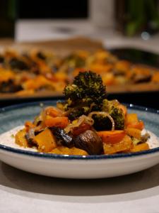 a plate of food with broccoli and other vegetables at Chalet Ski Académie - Serre Chevalier in Saint-Chaffrey