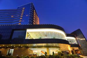 a building in front of a tall building at Dalian East Hotel in Jinzhou