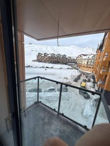 a view from a window of a snow covered street at New Gudauri, Hotel Peak in Gudauri