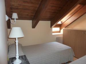 מיטה או מיטות בחדר ב-La buhardilla de Mayte