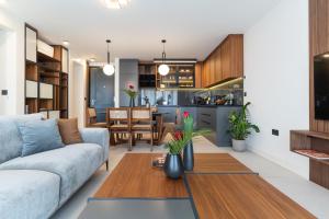 a living room with a couch and a table at EZ Luxury Living in Rovinj