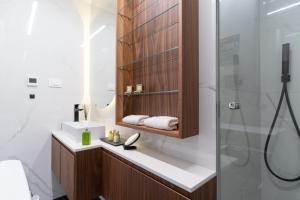 a bathroom with a sink and a shower at EZ Luxury Living in Rovinj