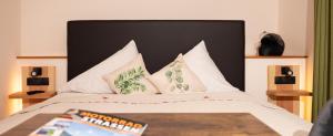 Letto o letti in una camera di Gasthof Rieder Stubn Hotel#Restaurant#Pinseria