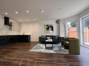 a living room with a couch and a table at Star London Finchley Road 3-Bed Escape with Garden in London