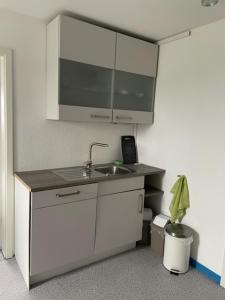 a kitchen with a sink and a counter top at Apartment Düte in Erpen