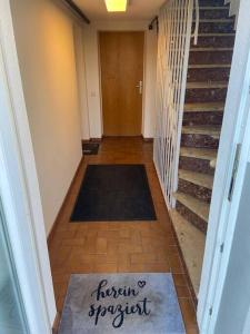 a hallway with a rug on the floor of a house at Entspannung im Grünen in Horn-Bad Meinberg