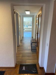 a hallway of a house with a rug on the floor at Entspannung im Grünen in Horn-Bad Meinberg